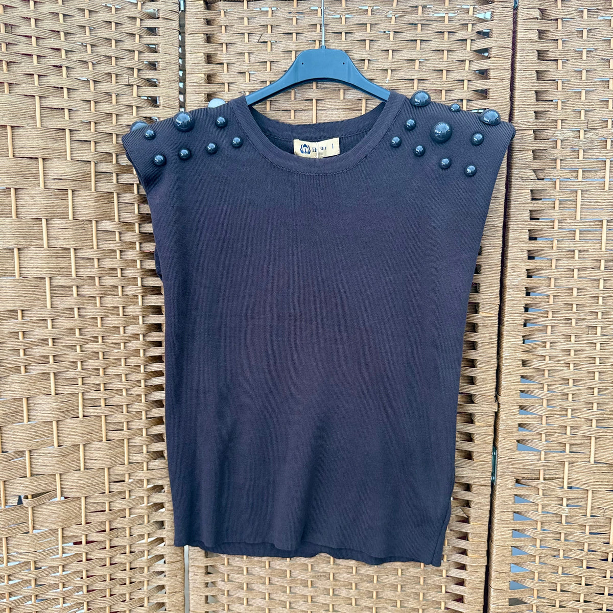 Beaded top with shoulder pads
