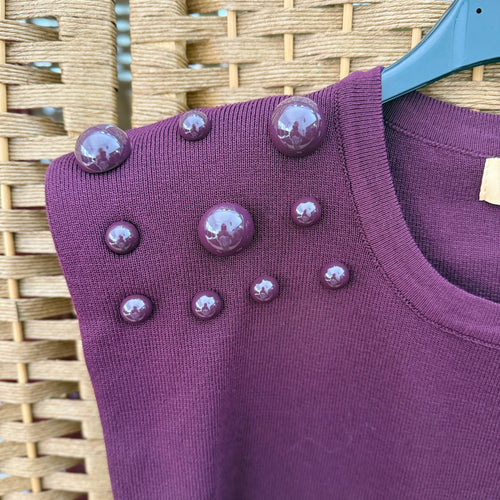 Beaded top with shoulder pads